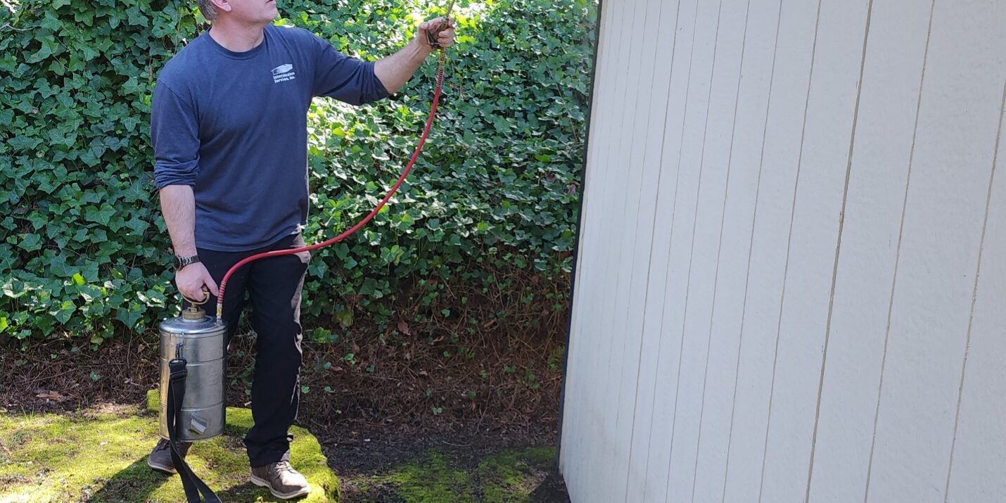 ESI Spraying Facia boards outside home